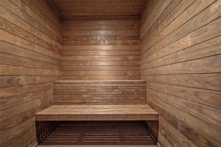 A luxurious retreat for relaxation, the sauna is beautifully clad in Thermory Cedar, offering both durability and a rich, natural aesthetic. Built-in bench seating provides a comfortable space to unwind, while the glass entry enhances the spa-like ambiance.