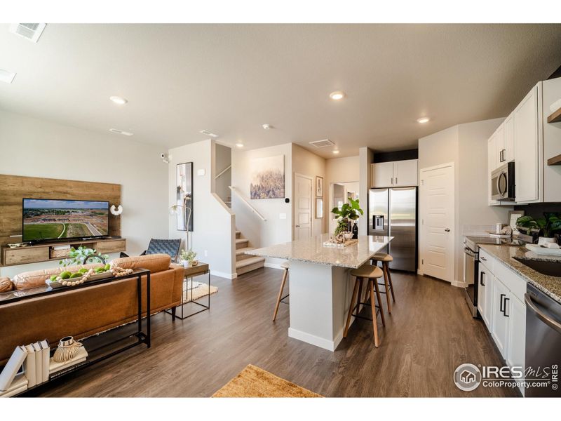 Stock photo, may contain additional upgrades - Living Room and Kitchen Stock photo, may contain additional upgrades - Living Room and Kitchen