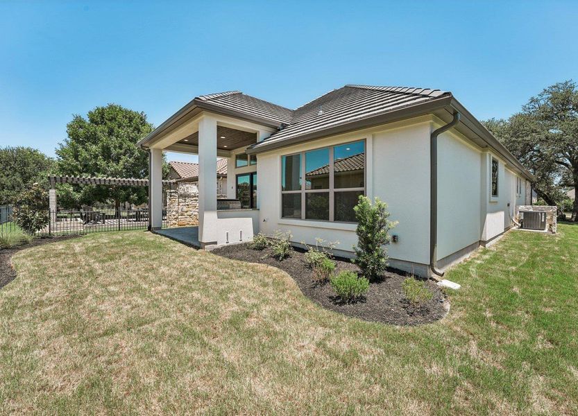 View of home's exterior featuring stucco siding and a tile roof