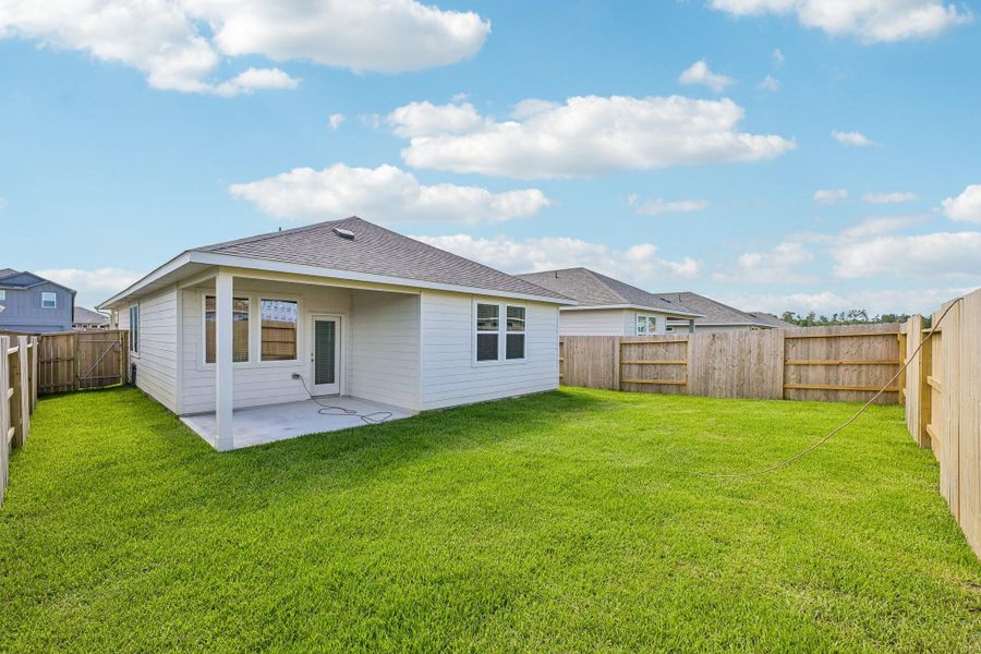 Exterior details and patio area of a home in Riviera Pines - Traditional Series, Huffman (Image 3).