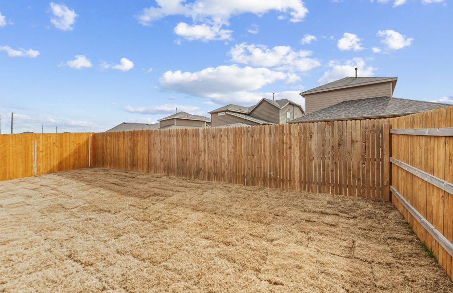 Exterior details and patio area of a home in Crosswinds, Kyle (Image 24).