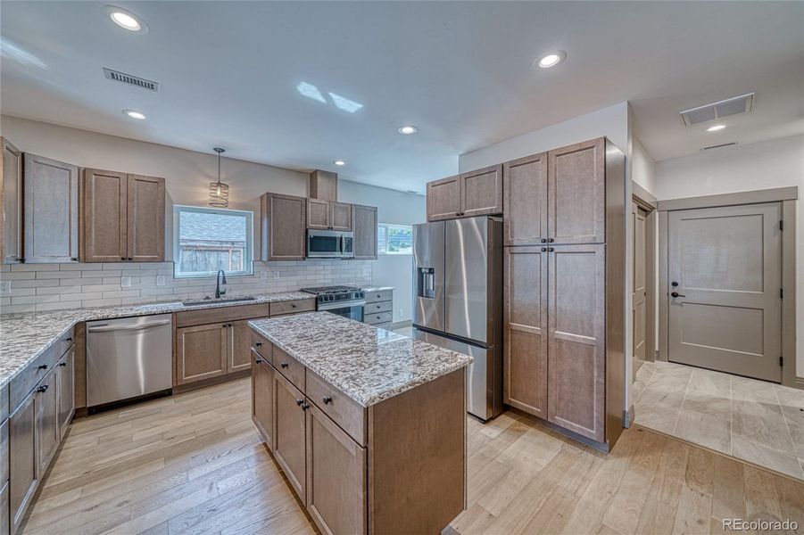 Spacious island for additional working spaces and storage.