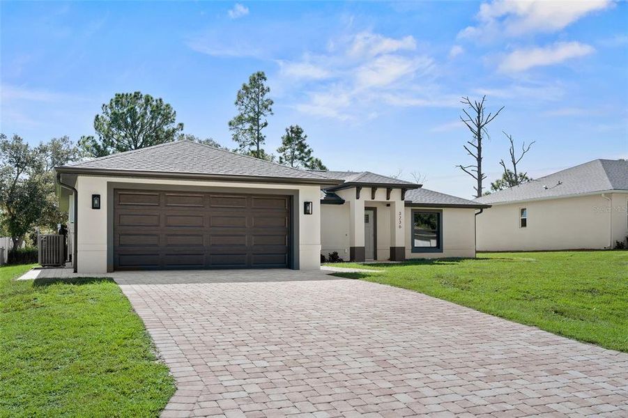 Front exterior of a new home in , North Port, FL, highlighting curb appeal (Image 1).