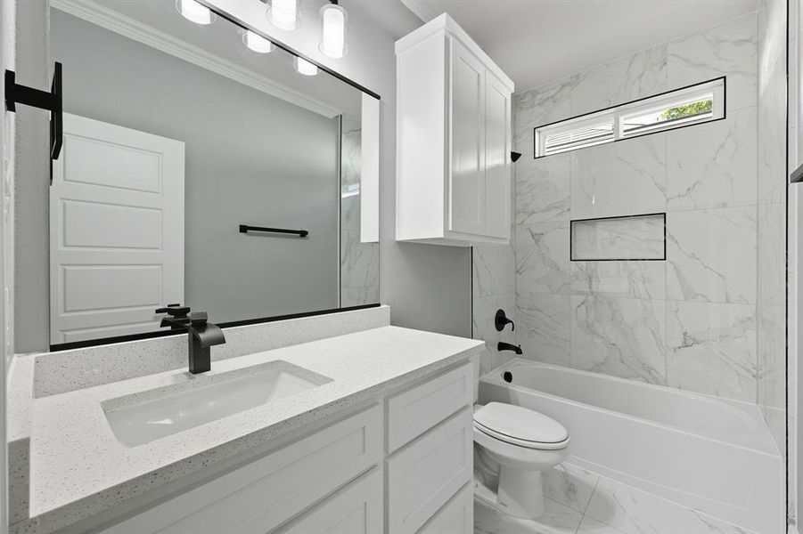 Full bathroom with marble finish flooring, shower / bathtub combination, and vanity Full bathroom with marble finish flooring, shower / bathtub combination, and vanity
