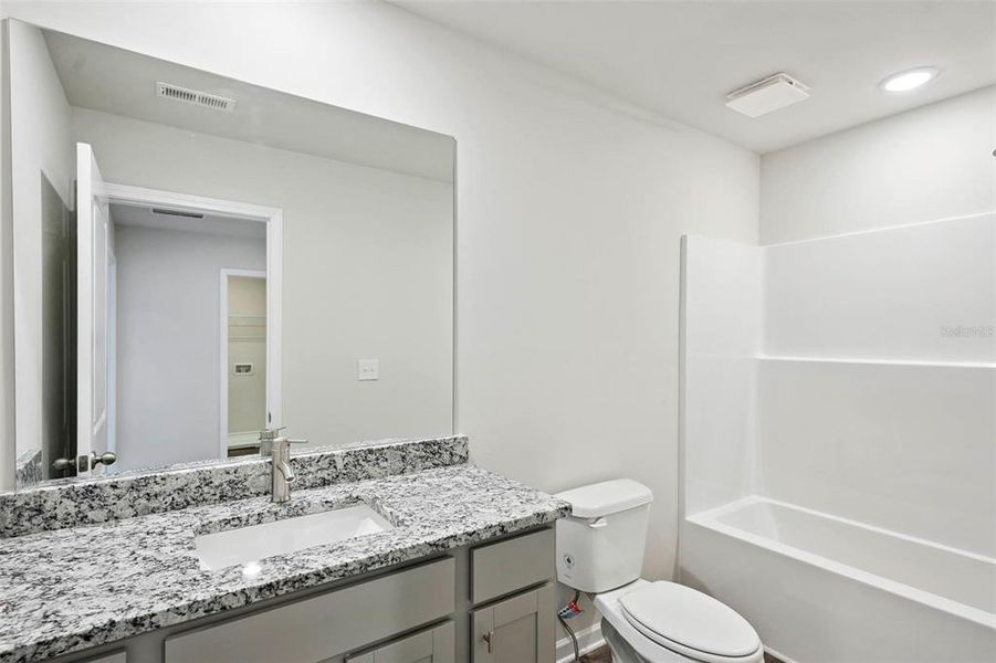 Furnished interior view inside a new home in The Enclave Townhomes, Hampton (Image 10).