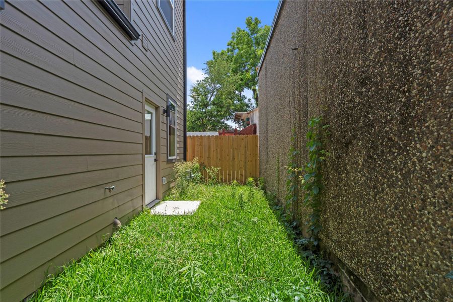 Private fenced side yard offers a convenient outdoor space for pets, gardening, or relaxing in the fresh air Private fenced side yard offers a convenient outdoor space for pets, gardening, or relaxing in the fresh air