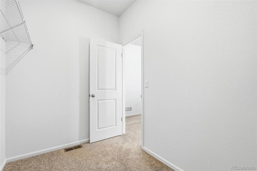 Spacious, unfurnished interior of a new home in Legato, Commerce City (Image 24).