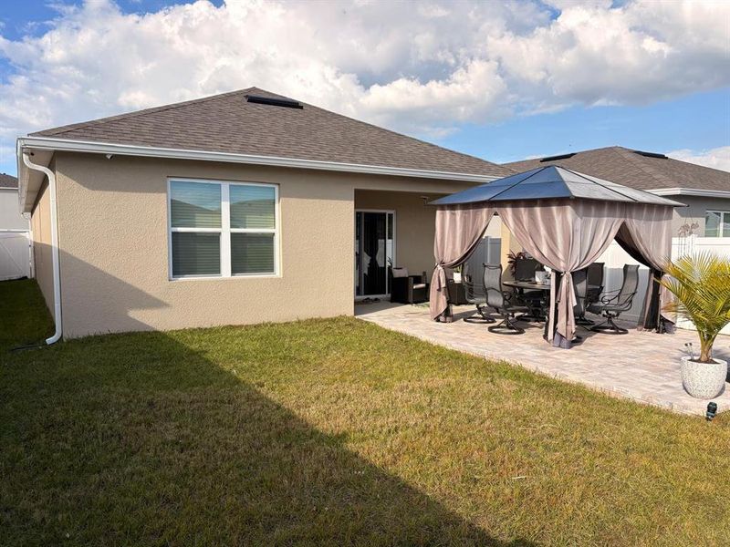 Exterior details and patio area of a home in Kindred, Kissimmee (Image 18).