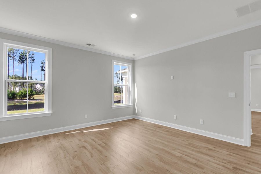 Spacious, unfurnished interior of a new home in Tidewater at Lakes of Cane Bay, Summerville (Image 27).