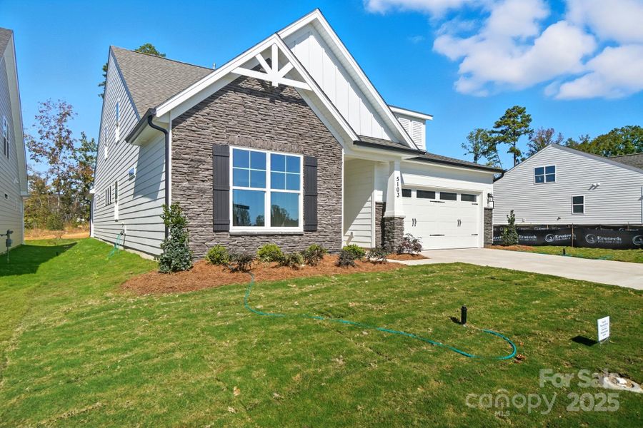 Exterior details and patio area of a home in Heritage - 55+ Community, Indian Trail (Image 19).
