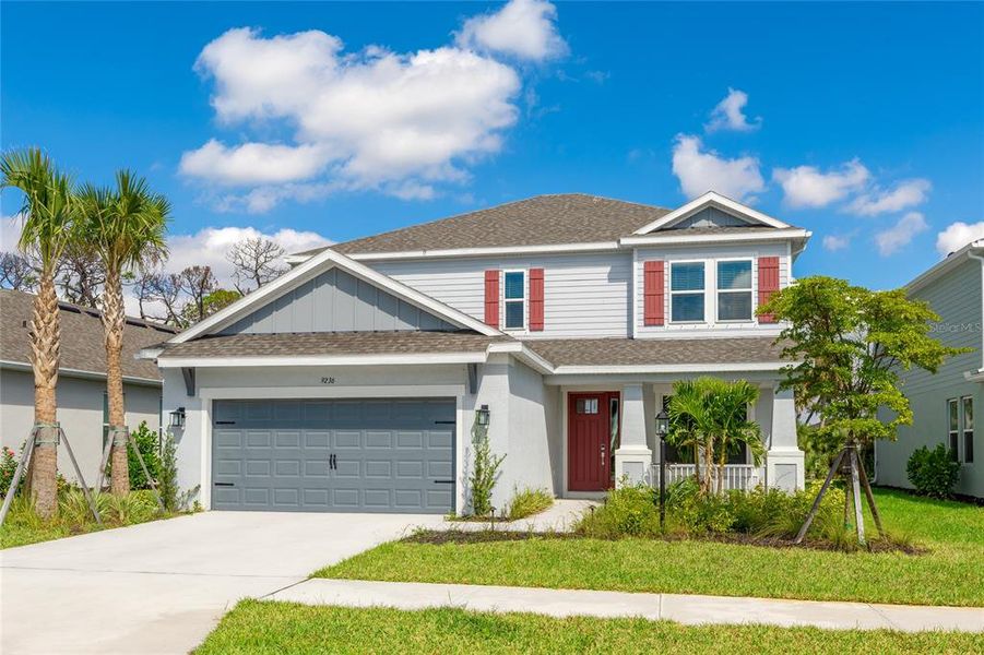 Front exterior of a new home in , Sarasota, FL, highlighting curb appeal (Image 1). Front exterior of a new home in , Sarasota, FL, highlighting curb appeal (Image 1).
