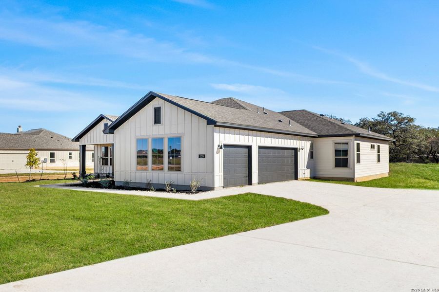 Front exterior of a new home in Pradera Ridge, Floresville, TX, highlighting curb appeal (Image 15).