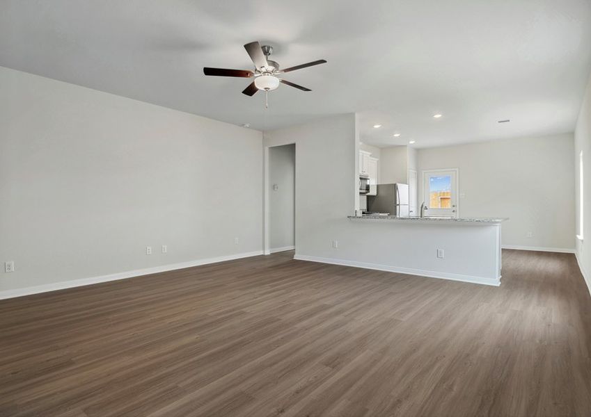 Family room and adjoining kitchen with plenty of natural light Family room and adjoining kitchen with plenty of natural light