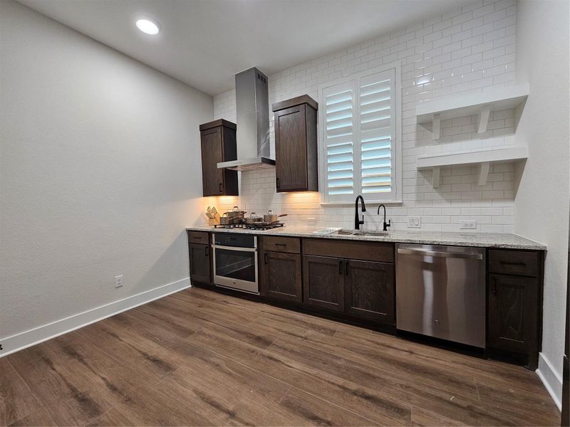Secondary kitchen equipped with a ventilation system to keep the rest of the home odor-free. Secondary kitchen equipped with a ventilation system to keep the rest of the home odor-free.