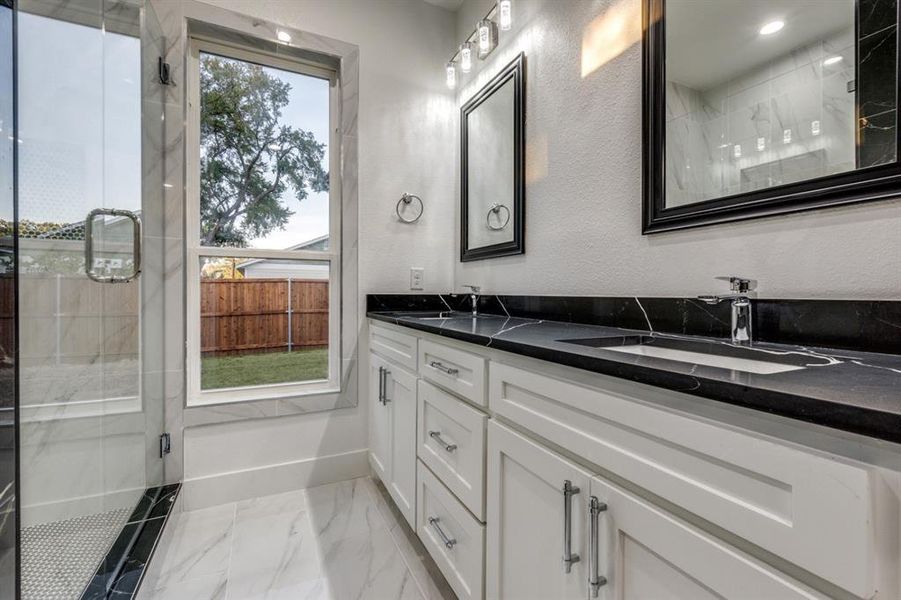 Bathroom with vanity and an enclosed shower