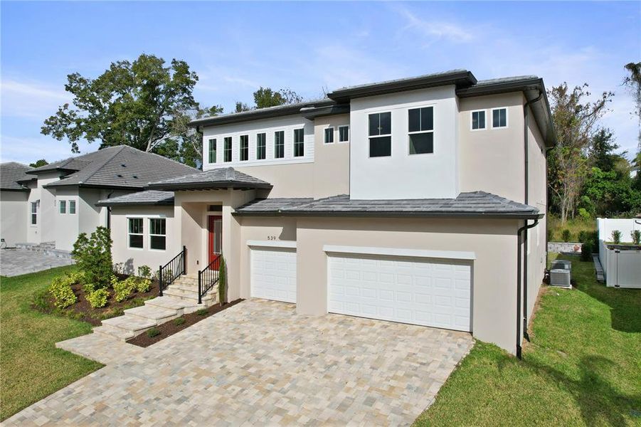 Front exterior of a new home in , Apopka, FL, highlighting curb appeal (Image 27).