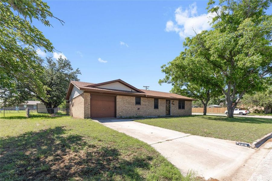 Front exterior of a new home in , Brownwood, TX, highlighting curb appeal (Image 15).