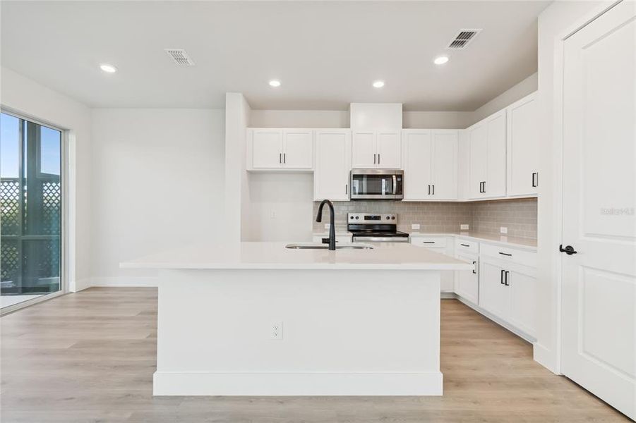 Furnished interior view inside a new home in North River Ranch – Townhomes, Parrish (Image 7).