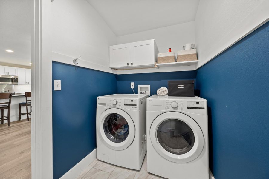 Landry room with storage.