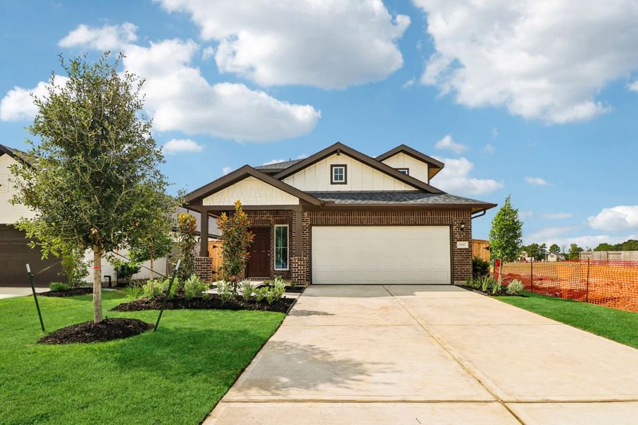 Front exterior of a new home in Sorella, Tomball, TX, highlighting curb appeal (Image 1). Front exterior of a new home in Sorella, Tomball, TX, highlighting curb appeal (Image 1).