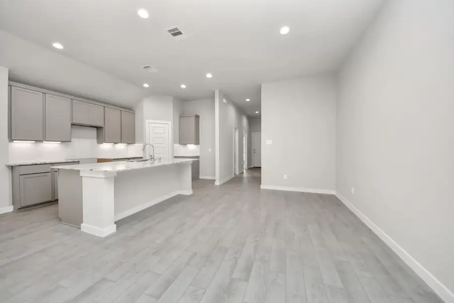 Craft enduring memories with loved ones around the table in this roomy dining area. It boasts stylish flooring, personalized paint, and is conveniently situated next to the family room and kitchen, fostering an open and inclusive ambiance. Sample photo of completed home with similar floor plan. Actual colors and selections may vary. Craft enduring memories with loved ones around the table in this roomy dining area. It boasts stylish flooring, personalized paint, and is conveniently situated next to the family room and kitchen, fostering an open and inclusive ambiance. Sample photo of completed home with similar floor plan. Actual colors and selections may vary.