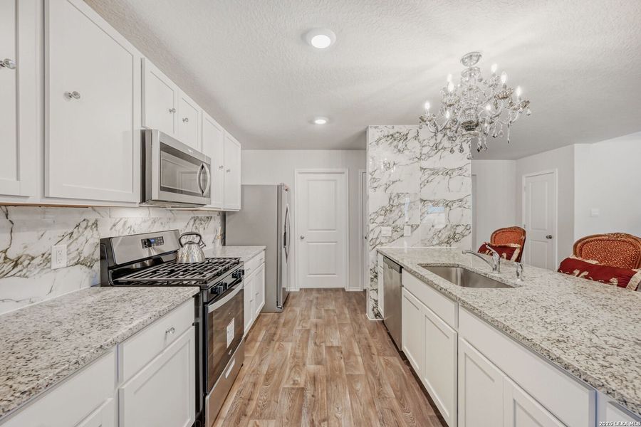 Furnished interior view inside a new home in Redbird Ranch, San Antonio (Image 6).