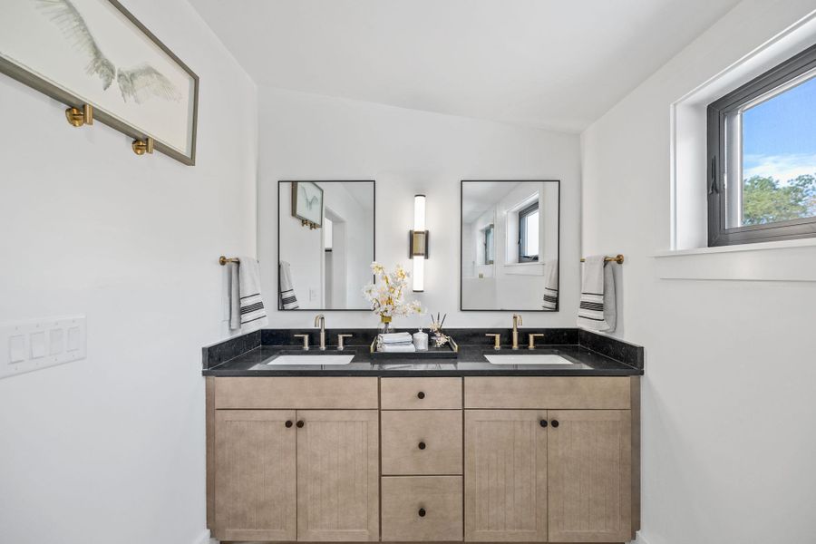 Bathroom with healthy amount of natural light and double vanity