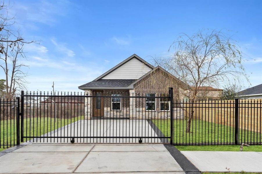 Welcome home to a stunning brick and stone exterior with gated entry for added privacy and security.