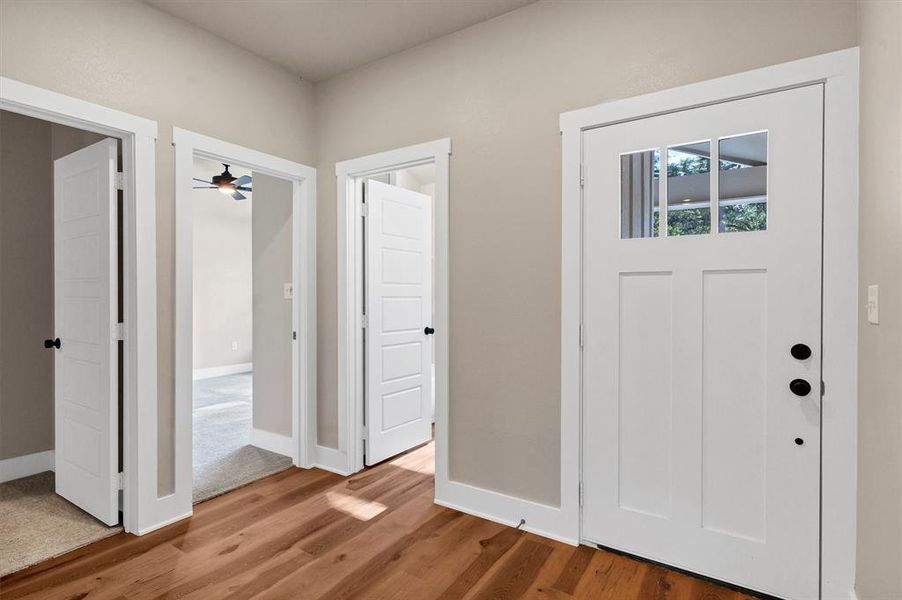 Entryway featuring wood finished floors and ceiling fan Entryway featuring wood finished floors and ceiling fan