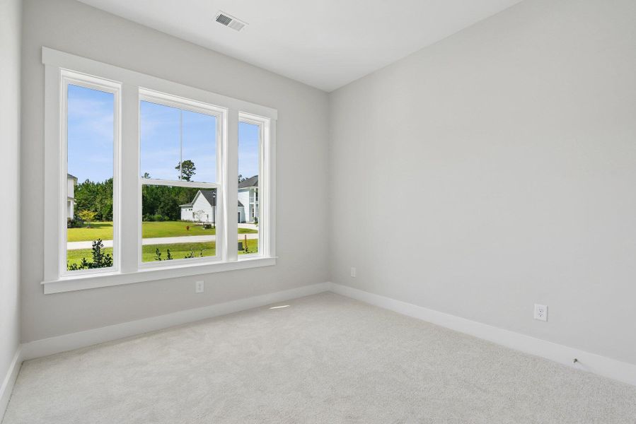 Spacious, unfurnished interior of a new home in Hidden Ponds Reserve, Awendaw (Image 24).