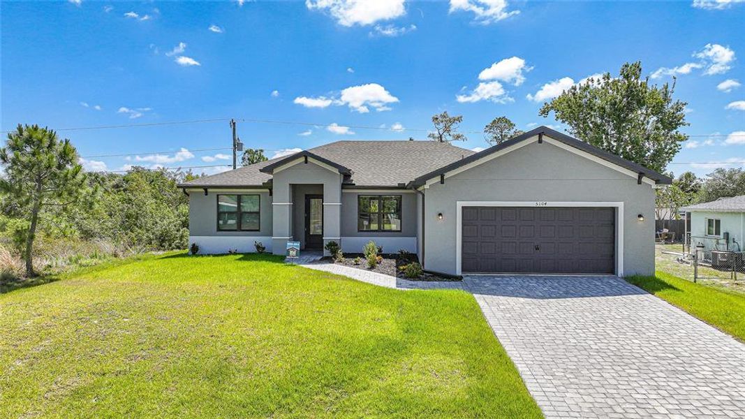 Front exterior of a new home in , Port Charlotte, FL, highlighting curb appeal (Image 1). Front exterior of a new home in , Port Charlotte, FL, highlighting curb appeal (Image 1).