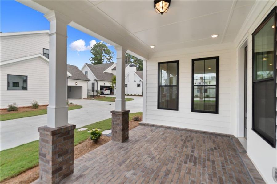 Exterior details and patio area of a home in Promenade at Sawnee Village, Cumming (Image 33).