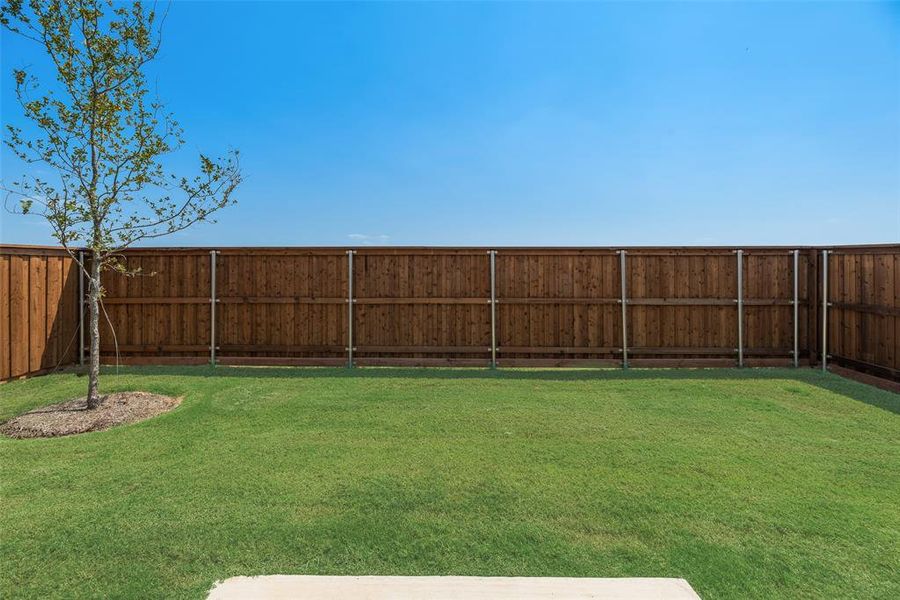 Front exterior of a new home in Spiritas Ranch, Little Elm, TX, highlighting curb appeal (Image 2). Front exterior of a new home in Spiritas Ranch, Little Elm, TX, highlighting curb appeal (Image 2).