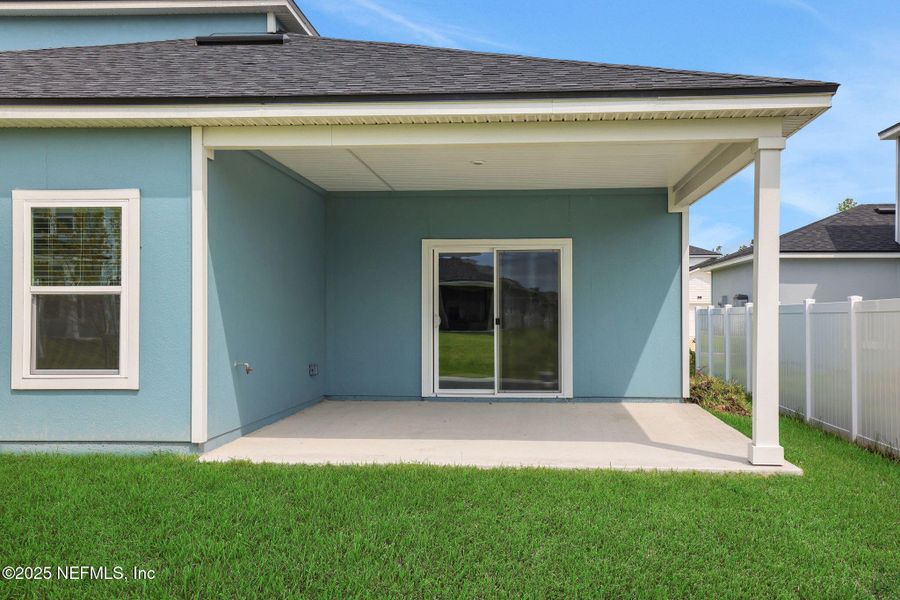Front exterior of a new home in Cordova Palms, St. Augustine, FL, highlighting curb appeal (Image 16).