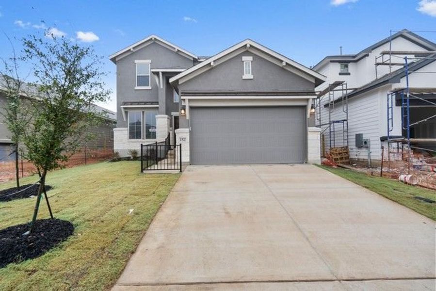 Front exterior of a new home in Morningstar, Georgetown, TX, highlighting curb appeal (Image 4).