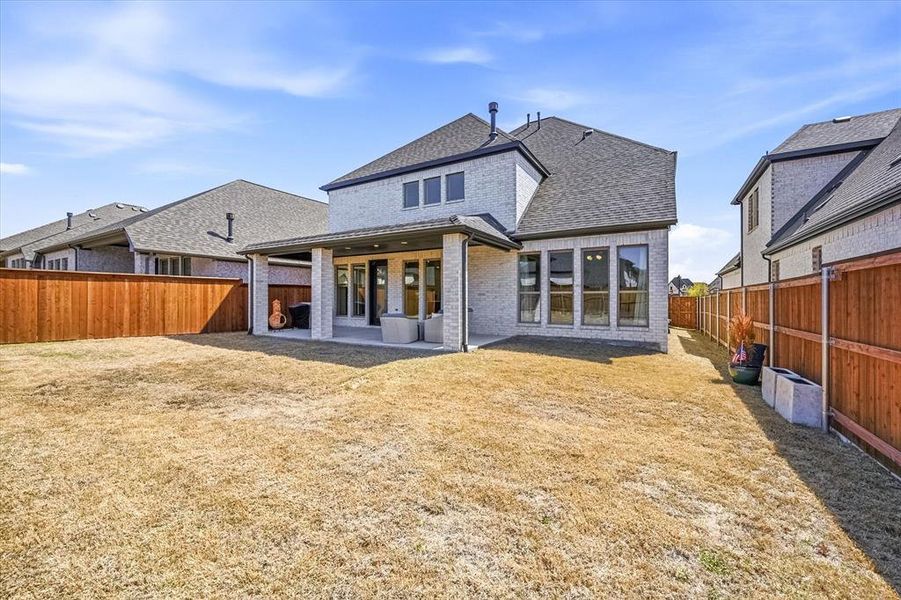 Exterior details and patio area of a home in Mustang Lakes, Celina (Image 4).