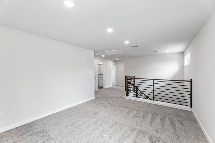 Representative unfurnished interior of a home built from the Alto by Hakes Brothers in The Woodlands, Mico (Image 11).