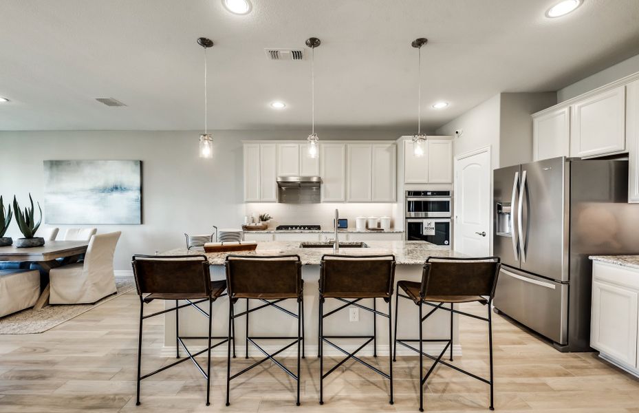 Gorgeous and spacious kitchen with eat-in bartop and recessed lighting