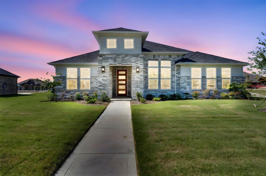 Front exterior of a new home in Ten Mile Creek Estates, DeSoto, TX, highlighting curb appeal (Image 19). Front exterior of a new home in Ten Mile Creek Estates, DeSoto, TX, highlighting curb appeal (Image 19).