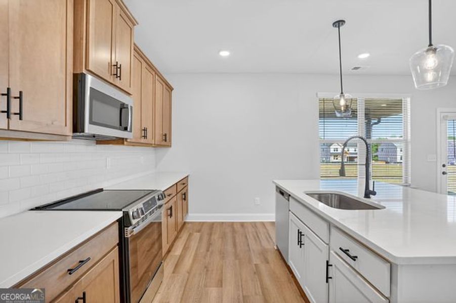 Furnished interior view inside a new home in Stone Brooke, Gray (Image 10).