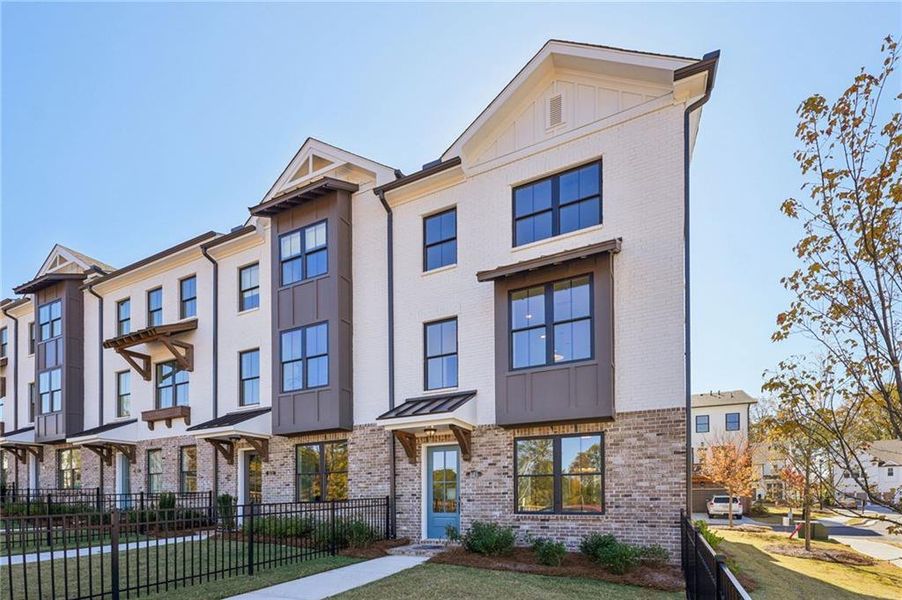 Front exterior of a new home in Palisades Townhomes, Cumming, GA, highlighting curb appeal (Image 23).