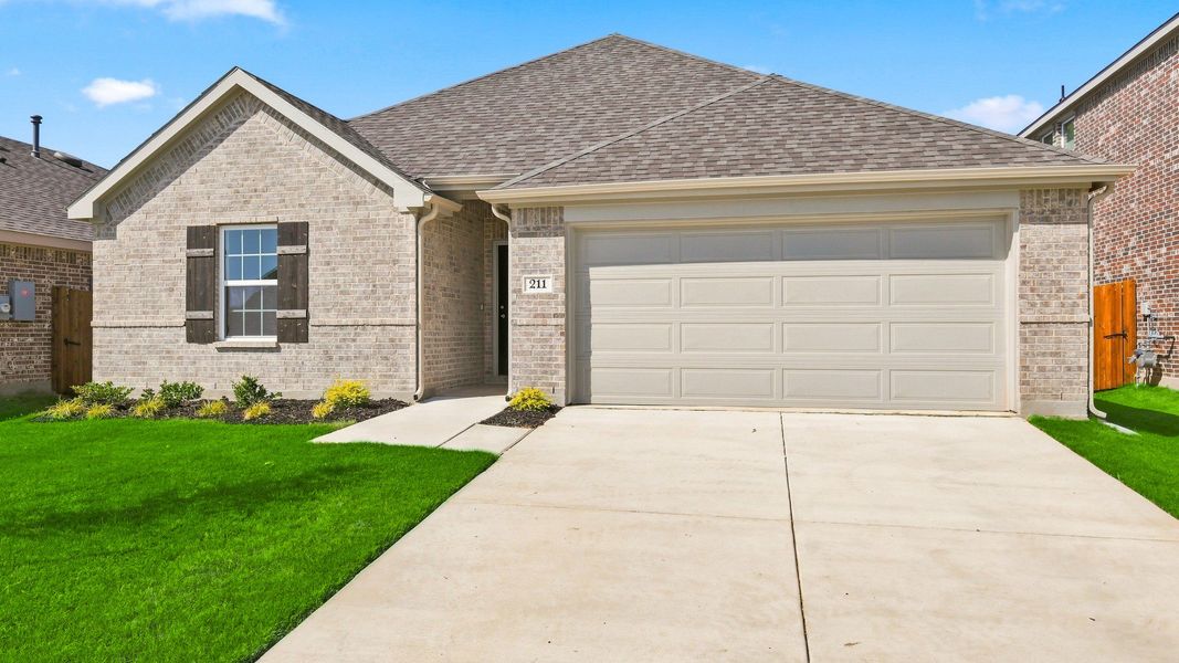 Front exterior of a new home in Patriot Estates, Venus, TX, highlighting curb appeal (Image 2). Front exterior of a new home in Patriot Estates, Venus, TX, highlighting curb appeal (Image 2).