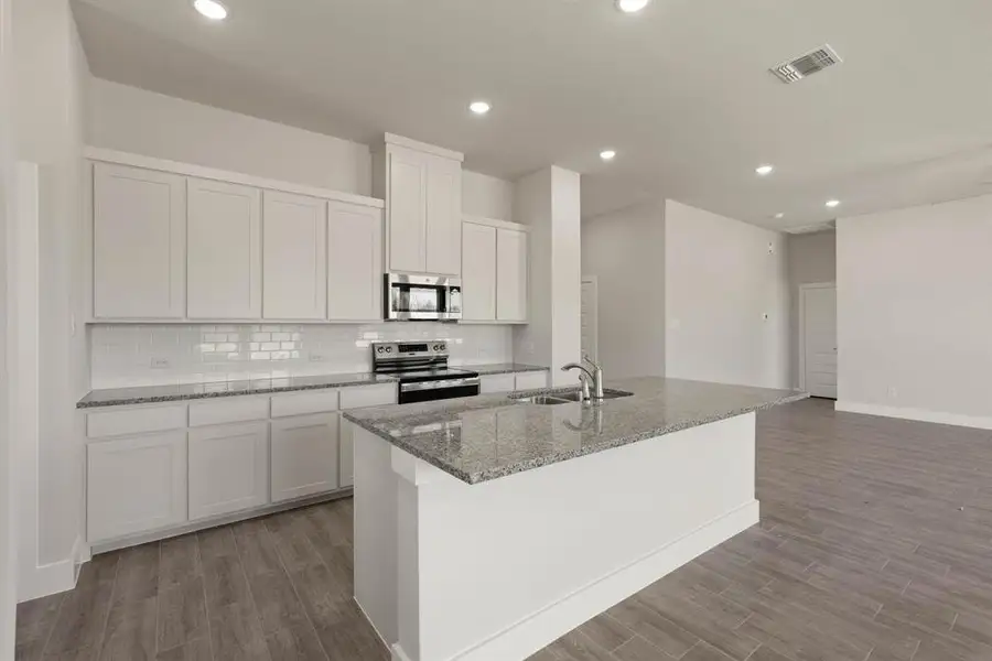 Furnished interior view inside a new home in Saddleback Estates, Boyd (Image 5). Furnished interior view inside a new home in Saddleback Estates, Boyd (Image 5).