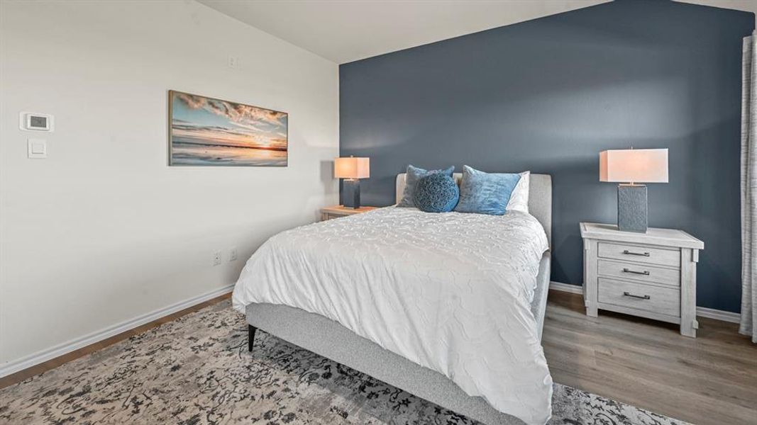 Bedroom with baseboards and light wood-style flooring