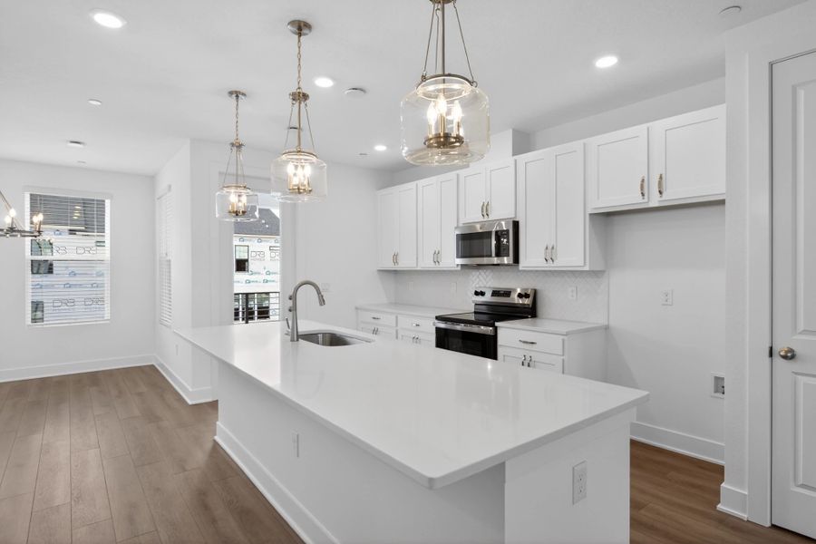 Furnished interior view inside a new home in Parkview at Hamlin, Winter Garden (Image 7).