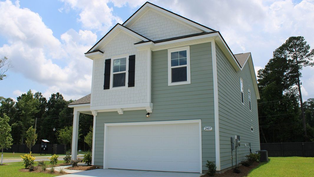 Front exterior of a new home in Auberon Woods, Conway, SC, highlighting curb appeal (Image 2).