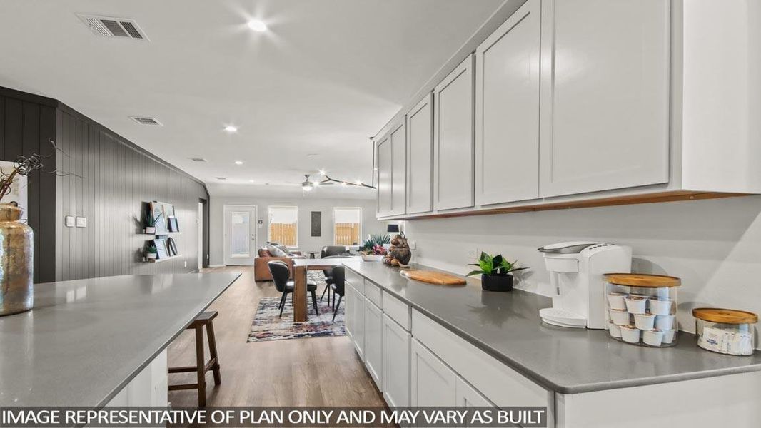 Furnished interior view inside a new home in Sunterra, Katy (Image 6).