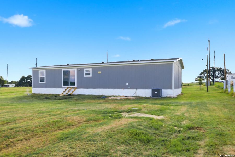 Exterior details and patio area of a home in , Atascosa (Image 23).