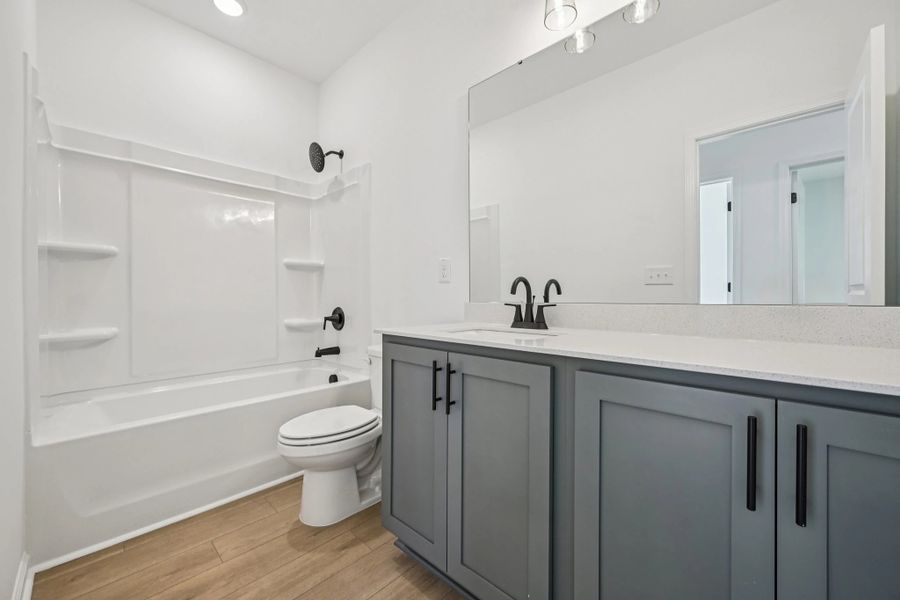 Bath 2 featuring the AW Collection® Minimalist - Strong lines and deep tones define the space.