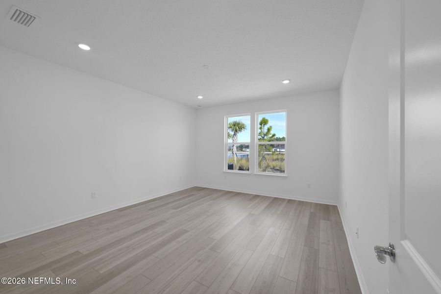 Spacious, unfurnished interior of a new home in Del Webb Wildlight, Yulee (Image 18).